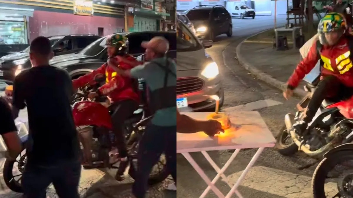 Motoboy ganha aniversário surpresa no farol, mas bolo explosivo gera revolta com chute na mesa
