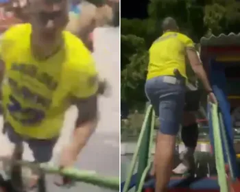 Policial armado e com camisa de Flávio troca socos com jovem em parquinho