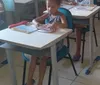 Criança é alfabetizada por ONG na periferia de Maceió imagem