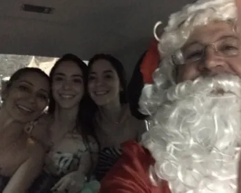 Família fica ilhada após chuva e é 'resgatada' por Papai Noel taxista